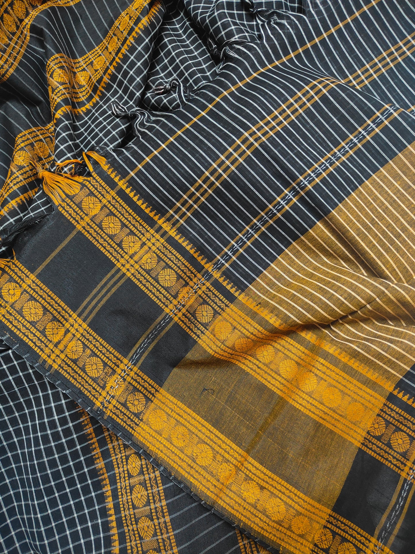 Black Korke Dure Check body contrast traditional border saree