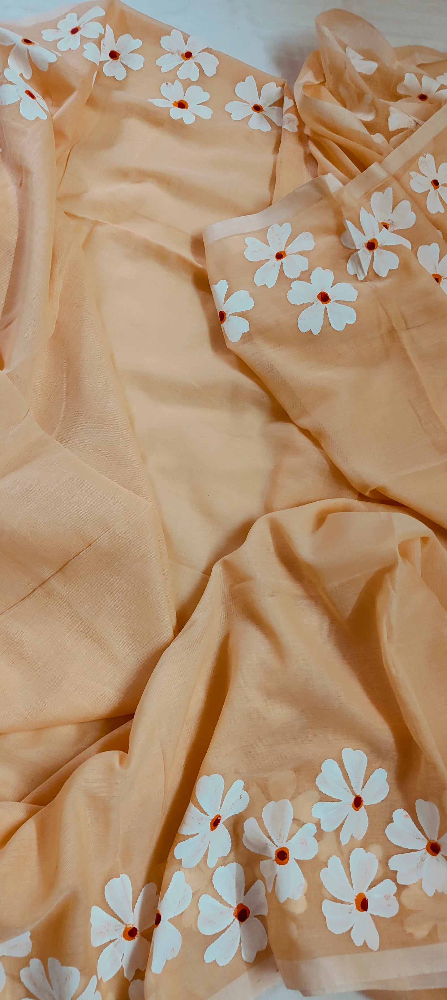 Chitrika – Coral Peach Hand Painted Mul Cotton Saree