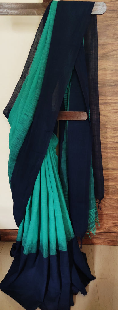 Dark sea green ikkat blended Plain border Linen Khadi Handloom Saree