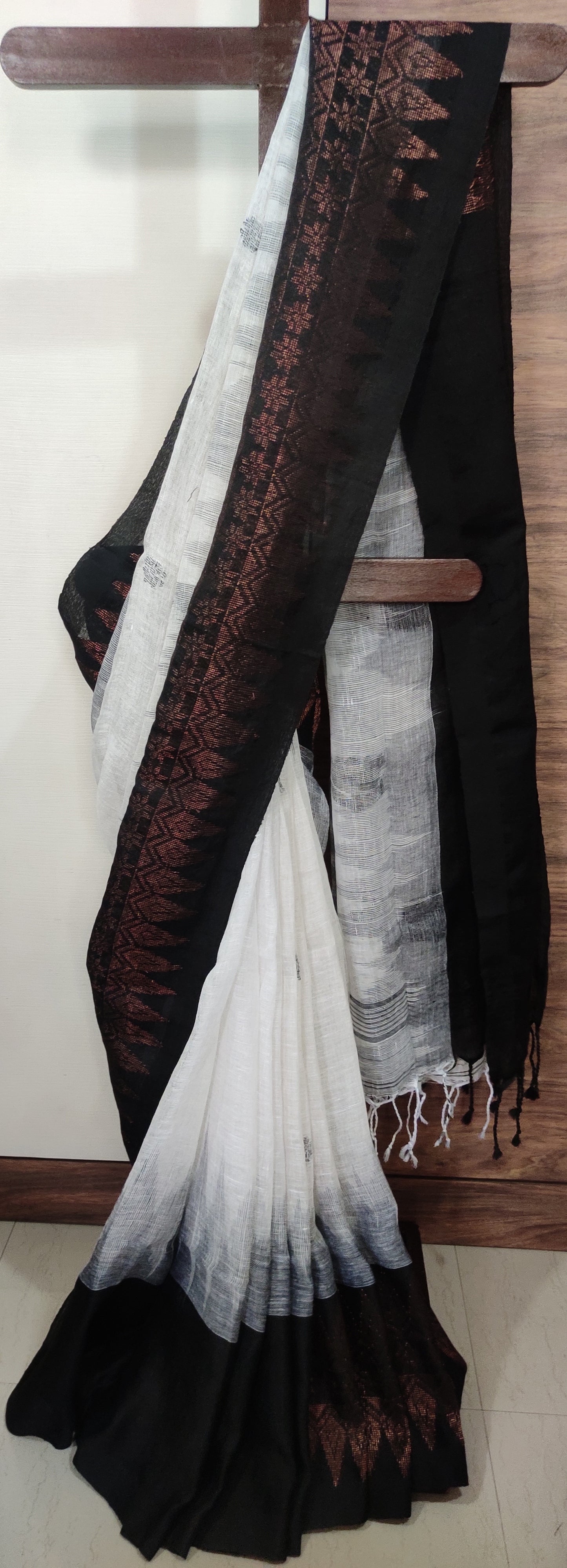 White Linen Ikkat blended zari worked black border done Saree
