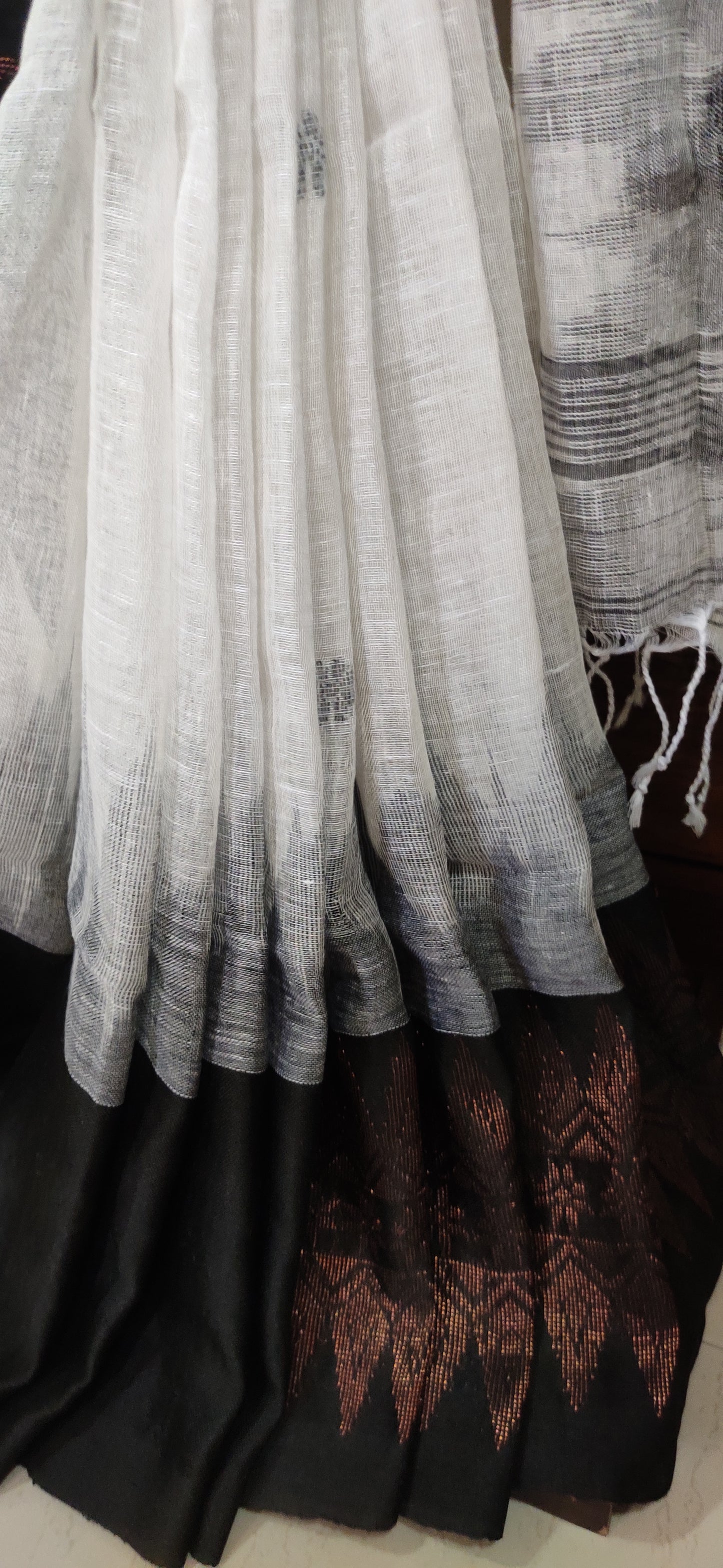 White Linen Ikkat blended zari worked black border done Saree