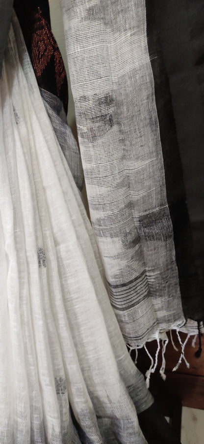 White Linen Ikkat blended zari worked black border done Saree