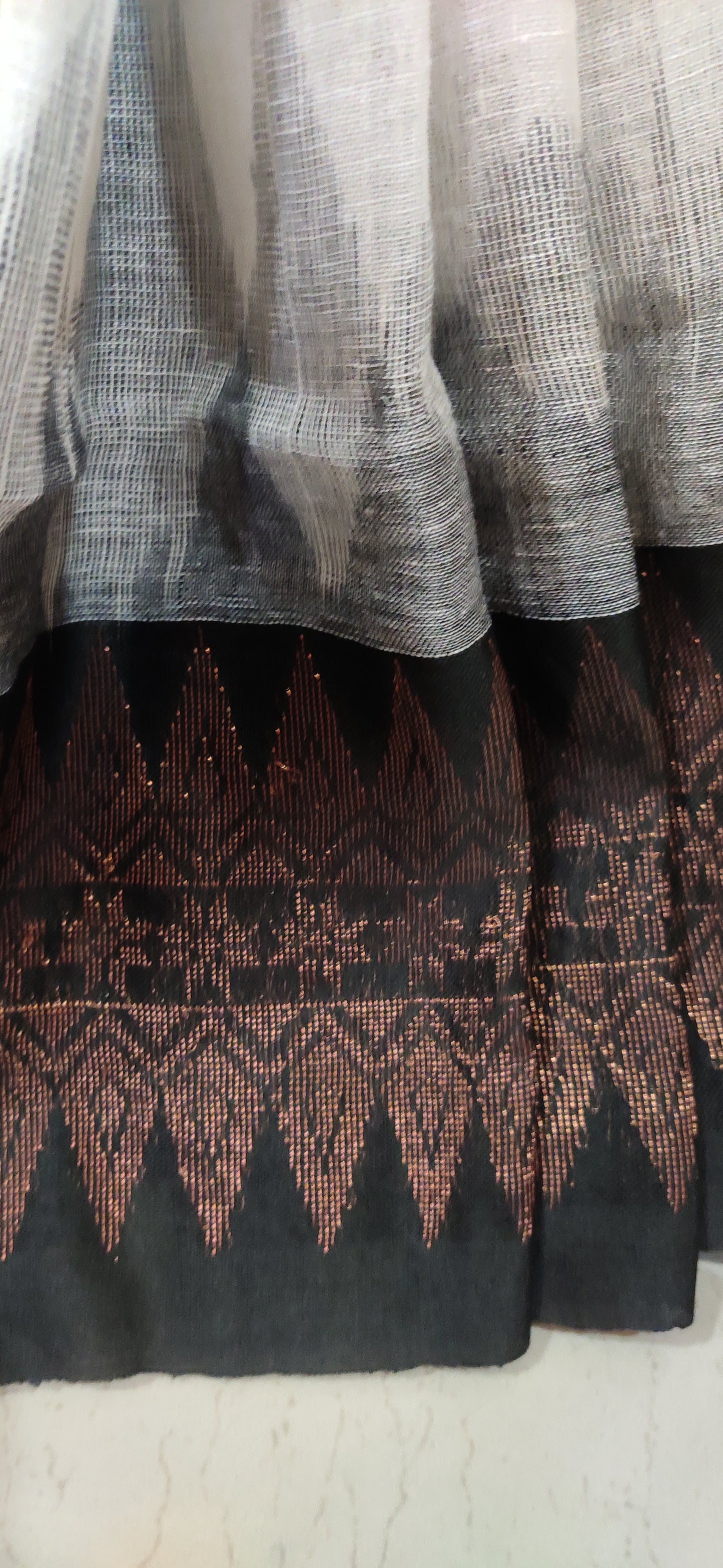 White Linen Ikkat blended zari worked black border done Saree