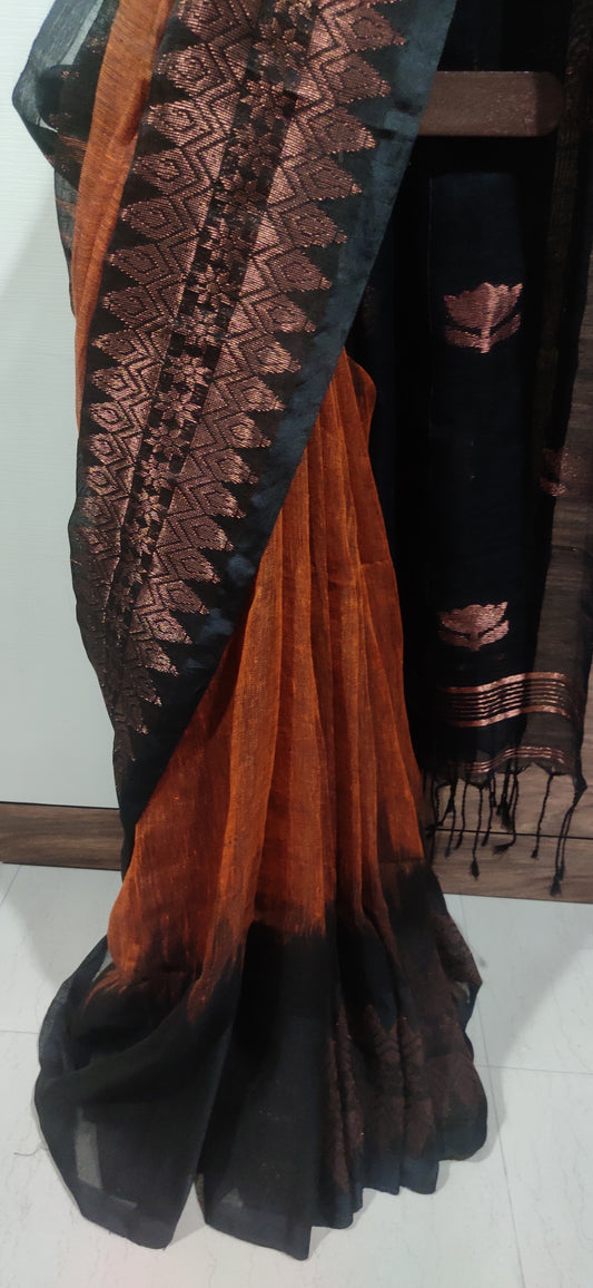 Rust Linen Ikkat blended zari worked black border done Saree