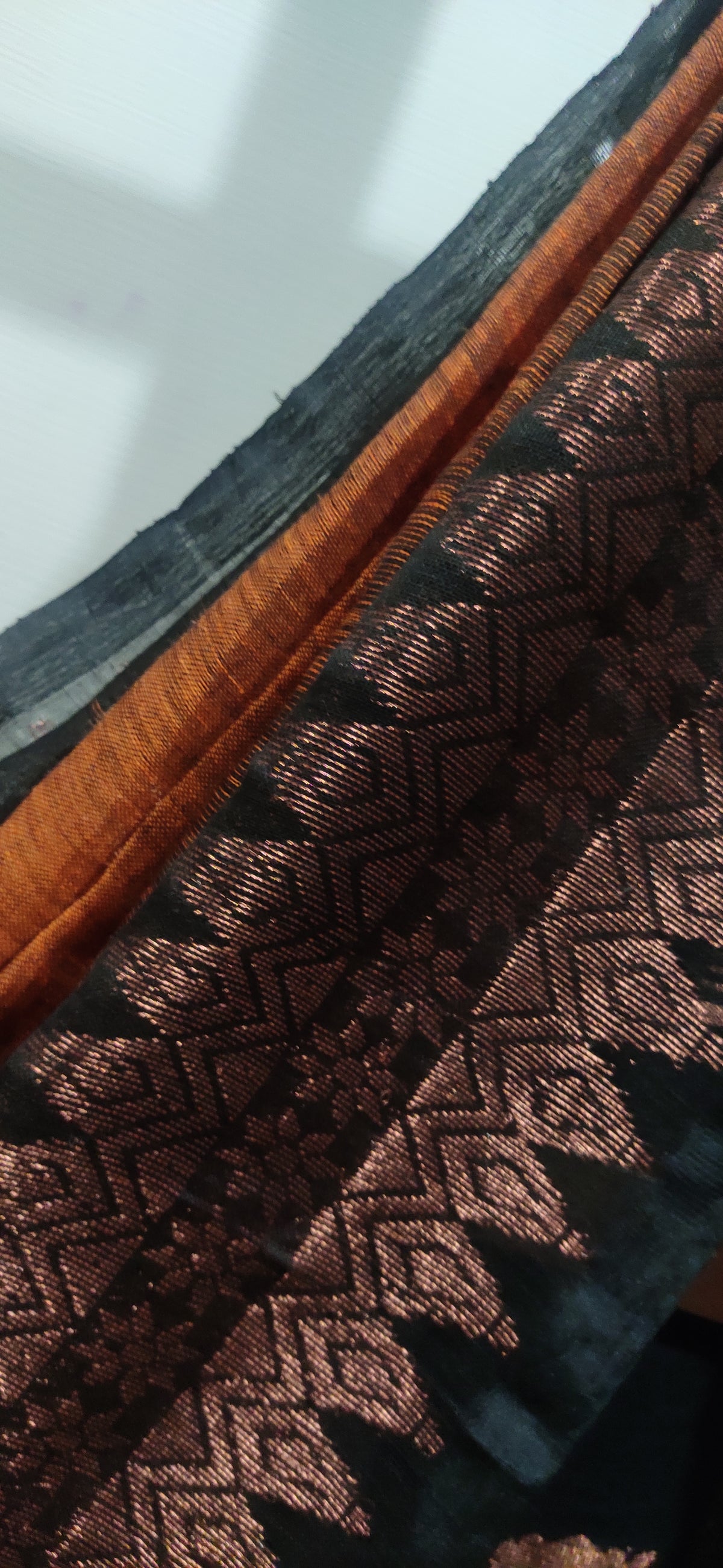 Rust Linen Ikkat blended zari worked black border done Saree
