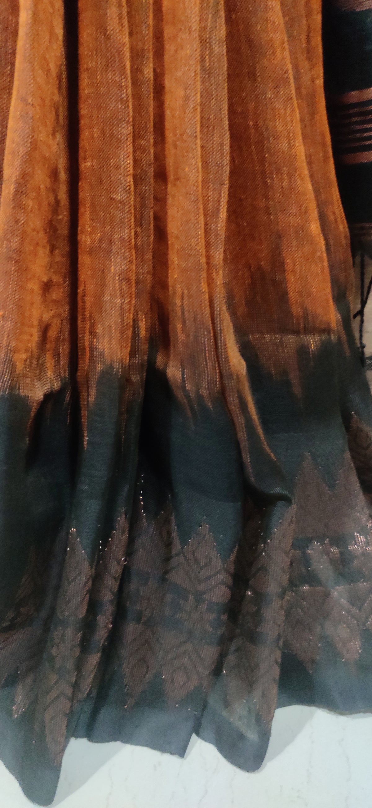 Rust Linen Ikkat blended zari worked black border done Saree