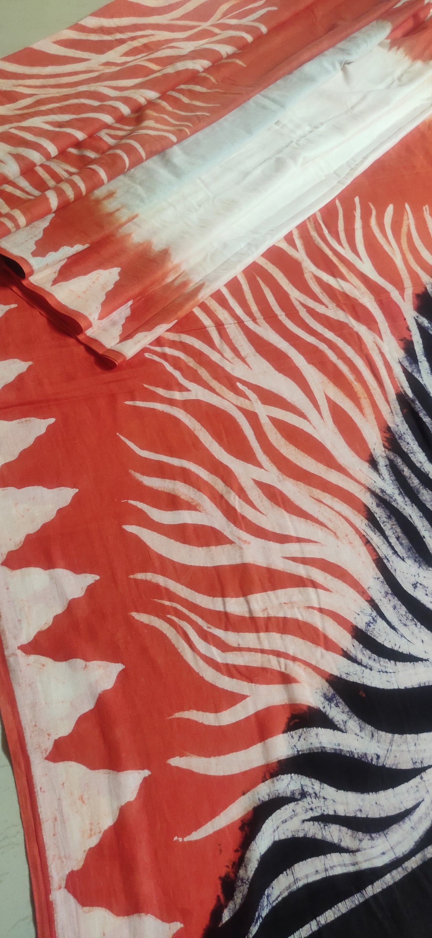 Agneya – White-Orange Hand Batik Cotton Saree