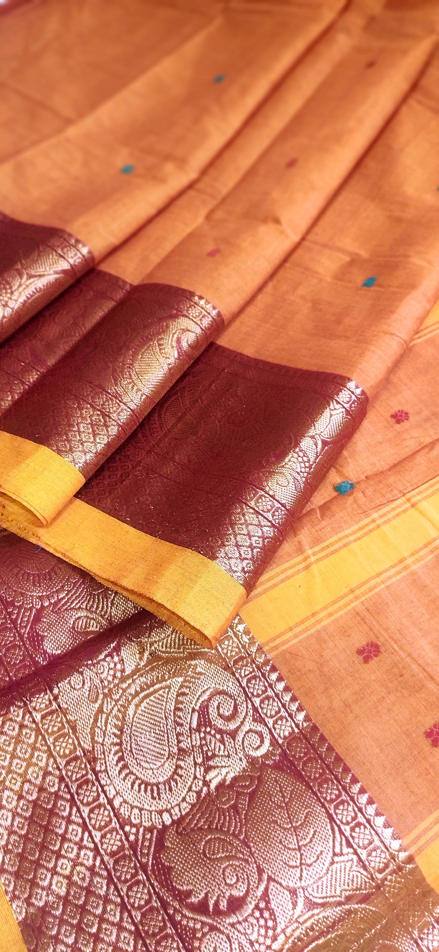 Orangish Yellow Cotton Dual Shaded Kanchipuram broad border with small buttas done all over body Saree