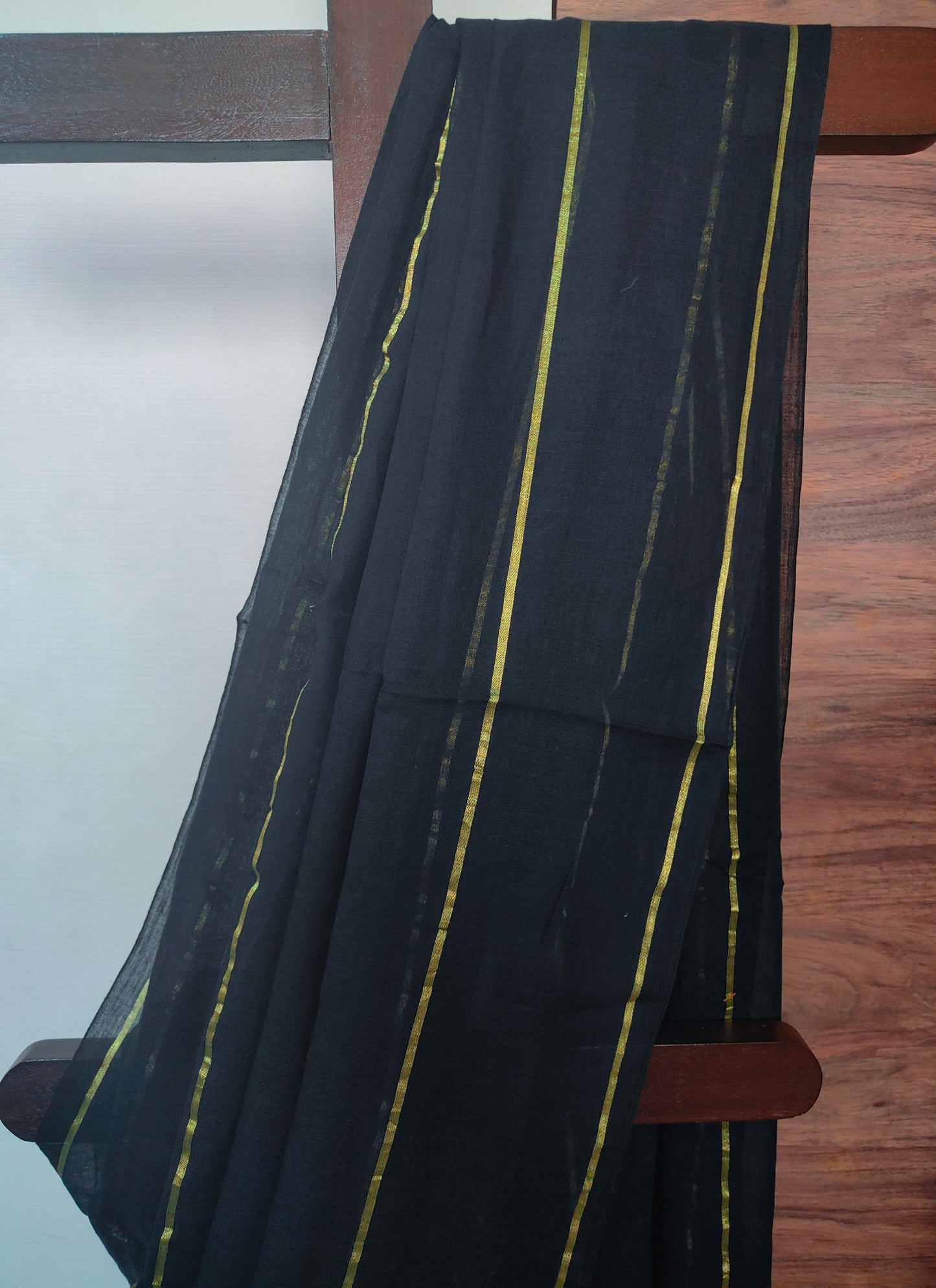 Eternal Black Mul Cotton single color zari stripped Saree