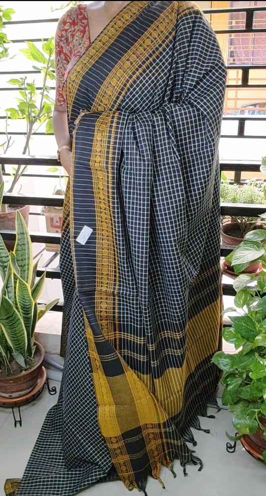 Black Korke Dure Check body contrast traditional border saree